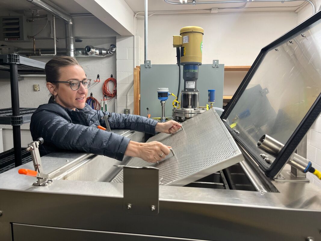 Rachel Bernhardt with the PET550 alkaline hydrolysis machine